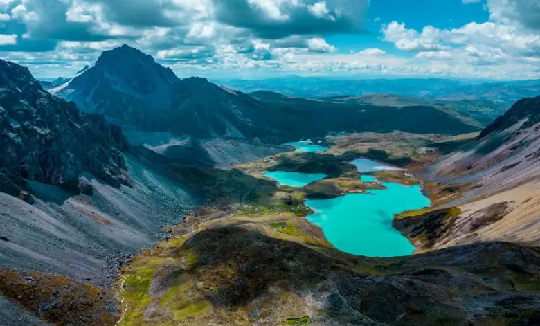 A breathtaking view of glaciers and colorful lakes surrounding Ausangate Mountain Peru